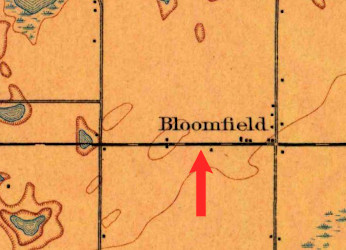 Closeup of a map with road lines and the word 'Bloomfield.'