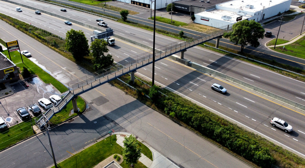 This pedestrian bridge crosses I-494 just west of the Minneapolis Airport.  It connects Bloomington to Richfield. I drive under it often and I wondere