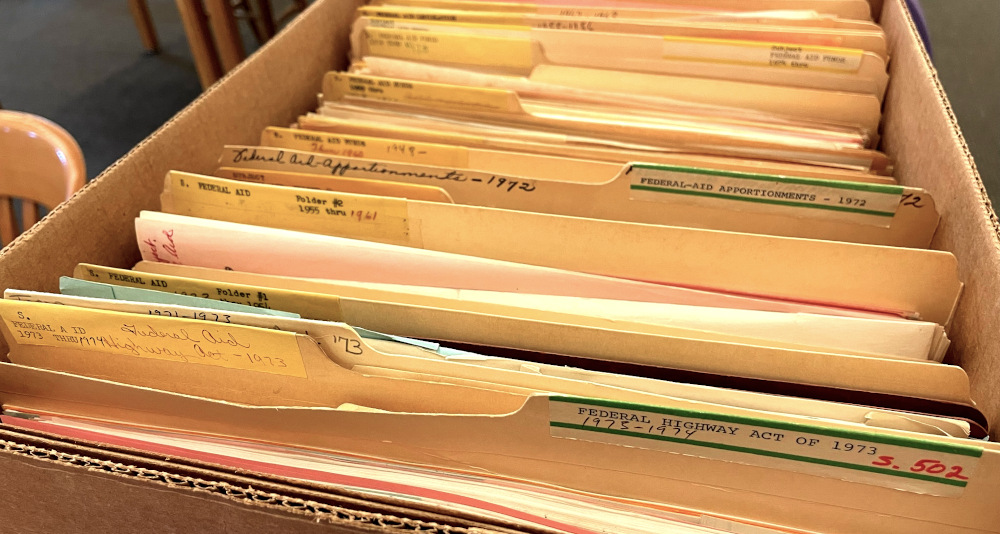 Photo of the folders of an insight of a records box. These pertain to federal highway and federal aid files.